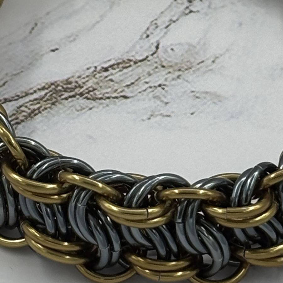 Black and bronze rings in a Vipera Berus weave